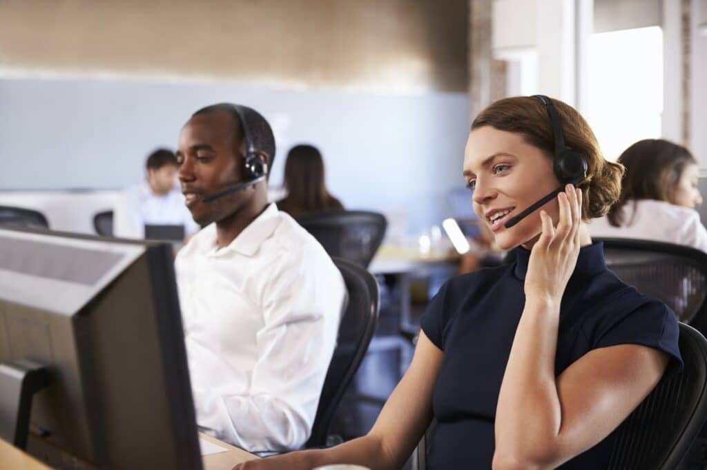 View Of Staff In Busy Customer Service Department